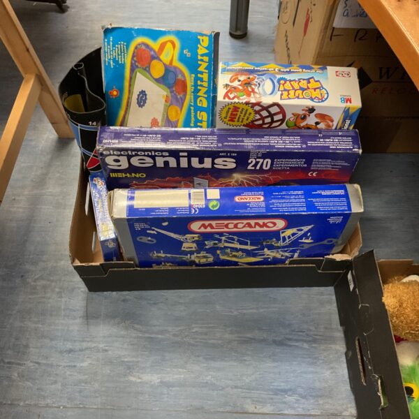 Crate of mixed board games including a Meccano set.