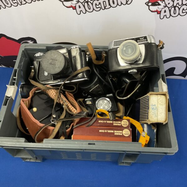 Vintage camera lot featuring Zenit and Canon film cameras.