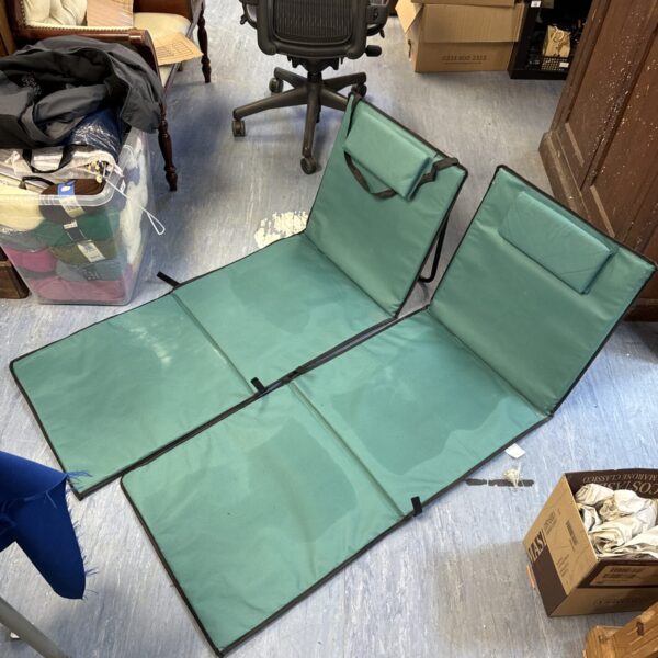 Pair of vintage folding beach loungers for garden or beach use.