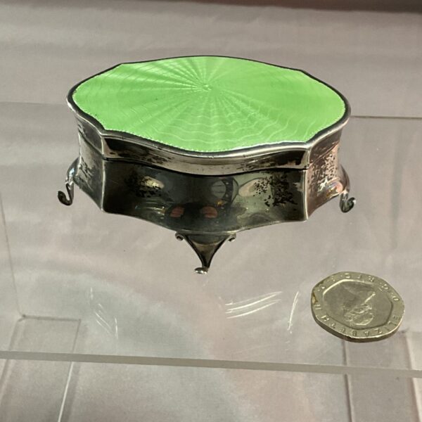 Silver Art Deco trinket pot with green enamel lid.