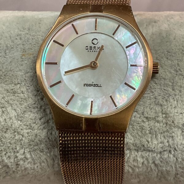 Vintage Obaku Harmony watch with mother of pearl dial and steel bracelet.