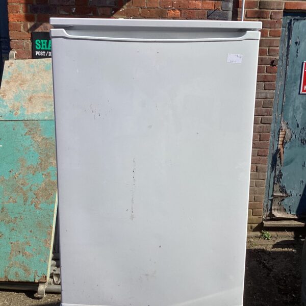 White under counter freezer in a kitchen setting.