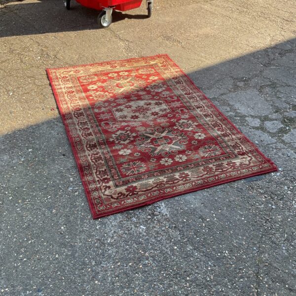 Red patterned Gooch Woburn rug made of New Zealand wool.