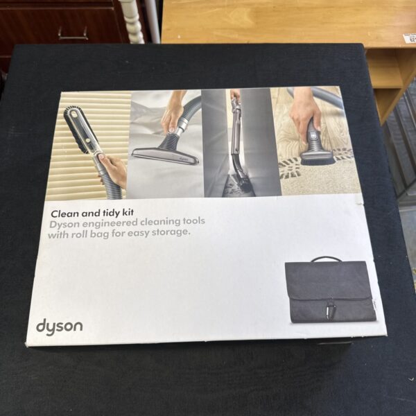 Unopened Dyson cleaning attachment set in original packaging.