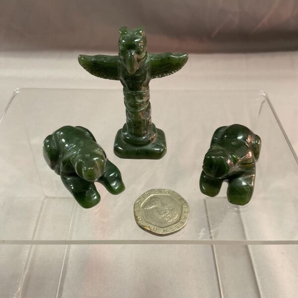 Hand-carved jade totem pole and polar bear figurines, Inuit art.