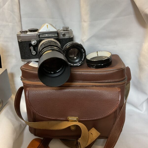 Vintage Petri Flex V 35mm film camera with protective case.