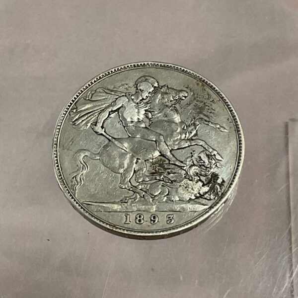 Silver 1893 Victoria Crown coin showing Queen Victoria's portrait.