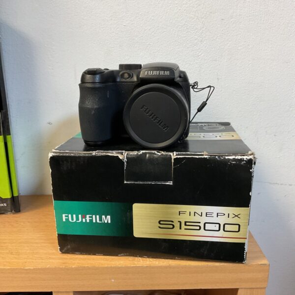 Fujifilm FinePix S1500 digital camera, black, front view.