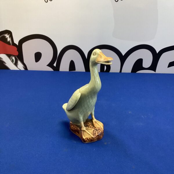 Vintage Chinese porcelain duck figurine, detailed and collectible.