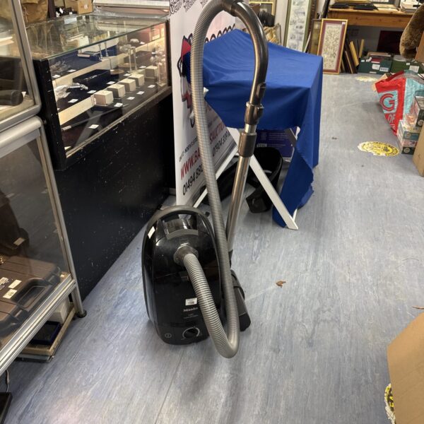 Miele S571 Superclean cylinder vacuum cleaner in a shop setting.