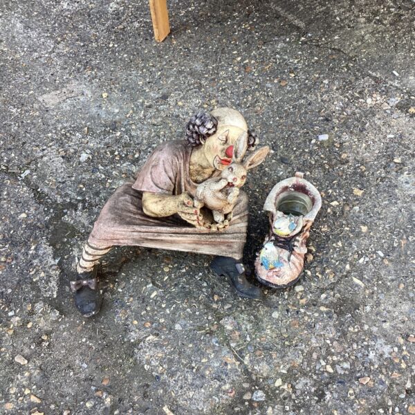 Vintage concrete clown garden ornament with rabbit.