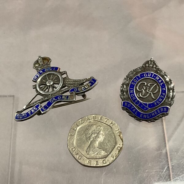 Vintage sterling silver Royal Artillery sweetheart badge with gun detail.