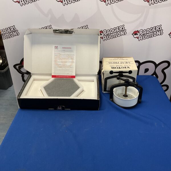 New boxed steakstone set with included meat press for cooking.