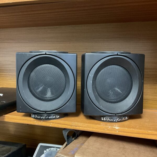 Pair of vintage Wharfdale Modus bookshelf speakers for home audio.