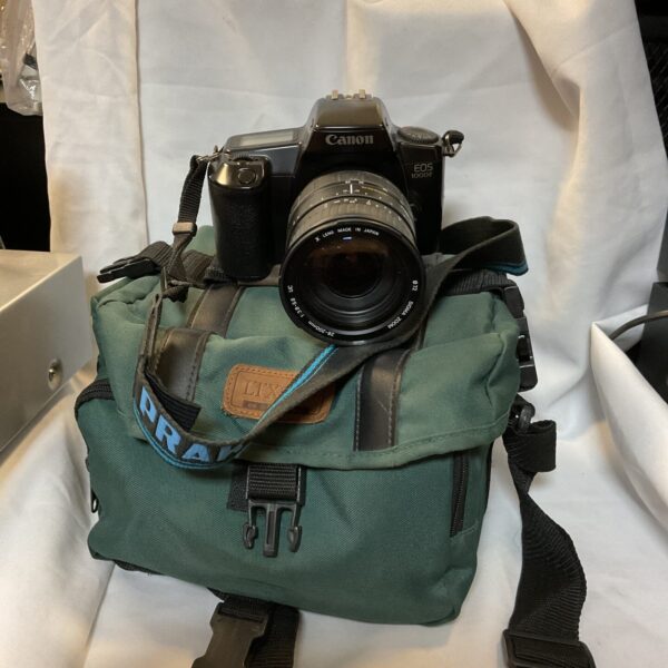 Vintage Canon EOS 1000F film camera with carrying case.