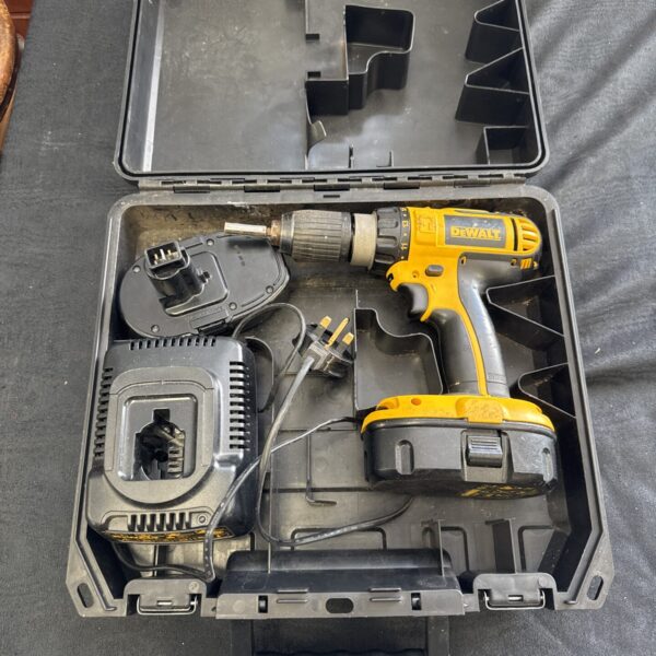 Open case showing Dewalt DC730 cordless drill with batteries and charger.