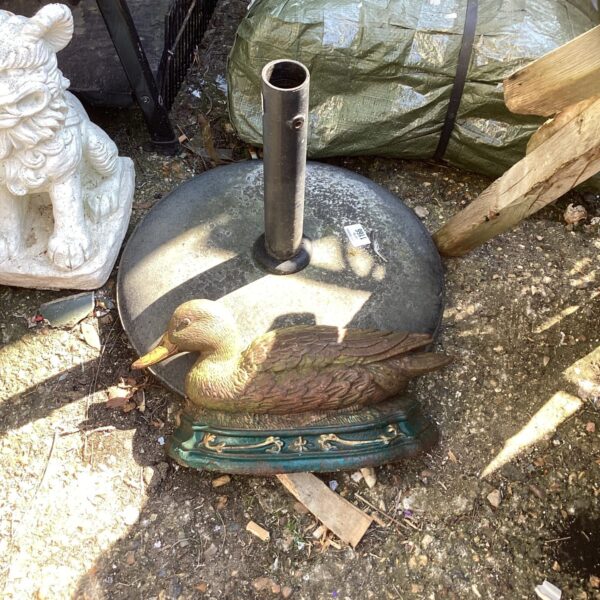 Vintage metal duck parasol base for garden or patio use.