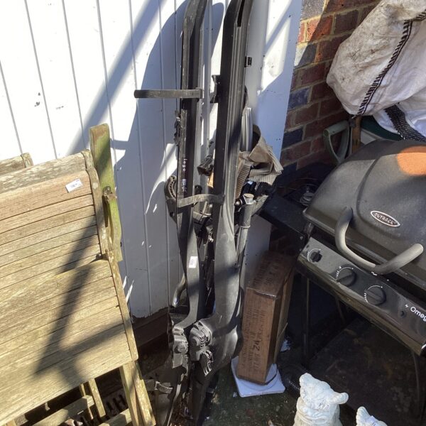 Used universal fit bike roof rack for secure transport.