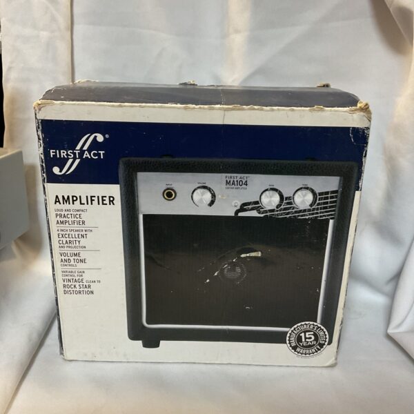Vintage First Act MA104 guitar amplifier with control knobs.