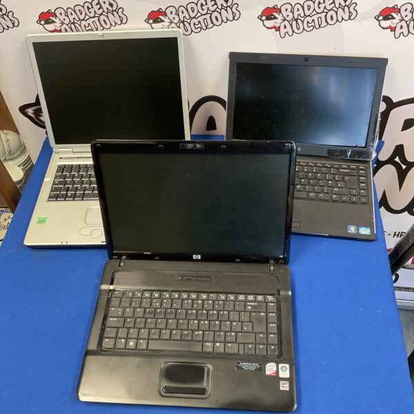 Used laptops lot including Dell, HP, and Neoware computers.