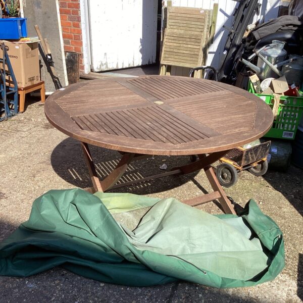 Large teak garden table with cover, ideal for restoration project.