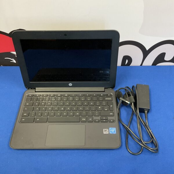 Front view of HP Chromebook laptop with charger.