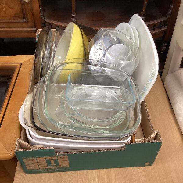 Vintage Pyrex kitchenware lot with glass dishes and scales.