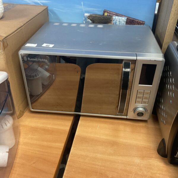 Front view of a used Russell Hobbs microwave oven.