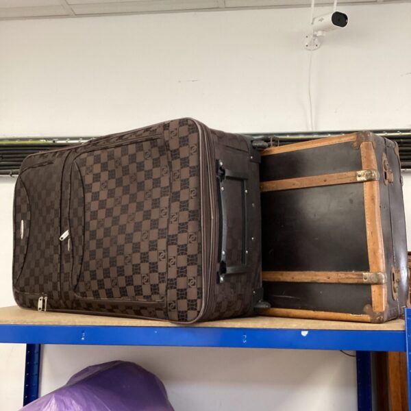 Vintage travel suitcase set with wheeled suitcase and leather trunk.
