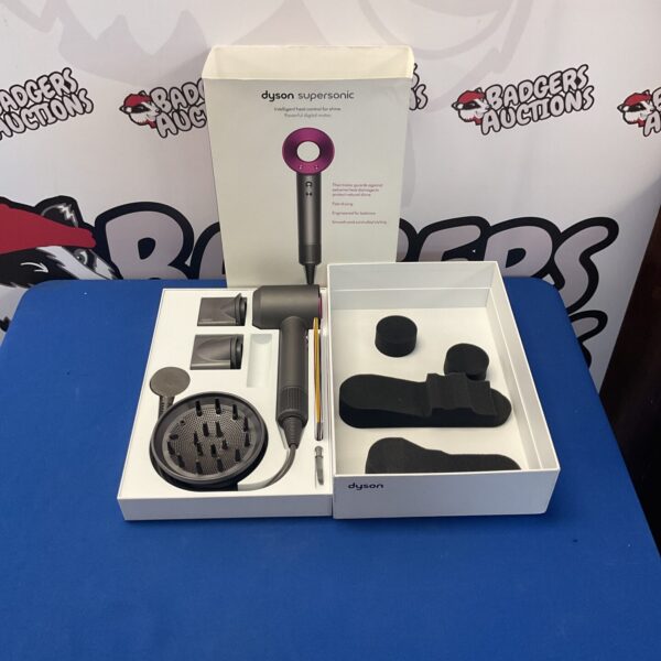 Boxed Dyson Supersonic hairdryer with attachments and manuals.