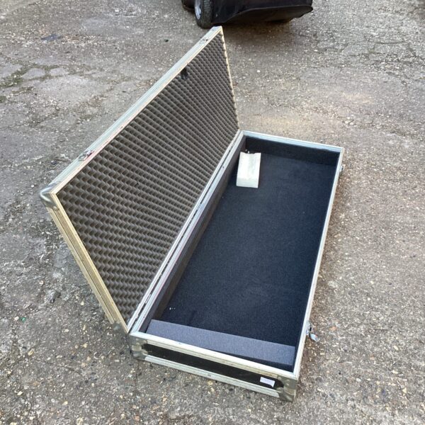 Padded aluminium storage box open, showing interior foam lining.