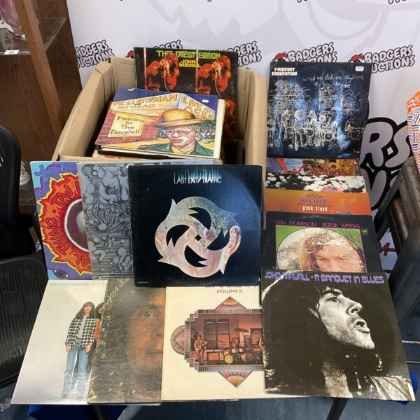 Vintage vinyl record lot featuring Pink Floyd and Cream albums.