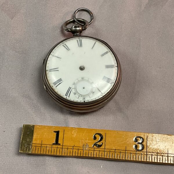 Antique silver pocket watch by Robert Rossellini with white enamel dial.