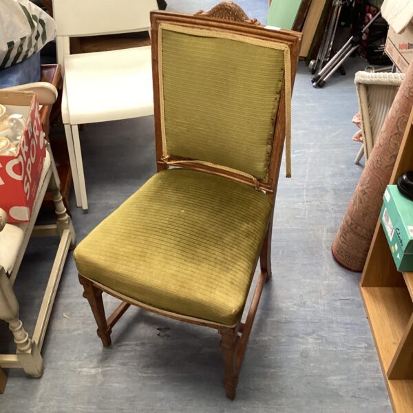 Antique Louis XVI chair with green upholstery and carved frame.
