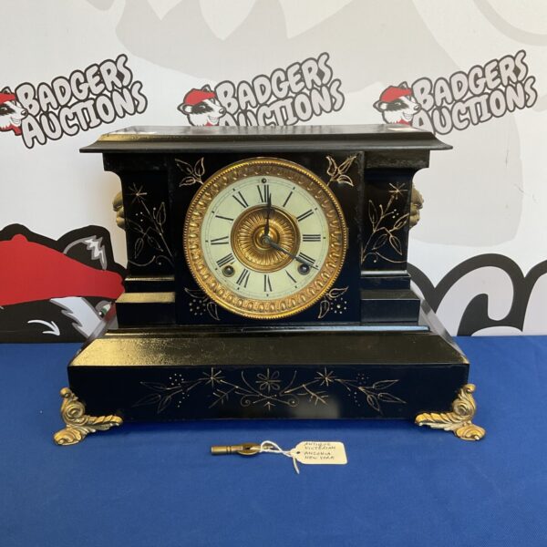 Victorian Ansonia slate mantle clock with detailed moulding.