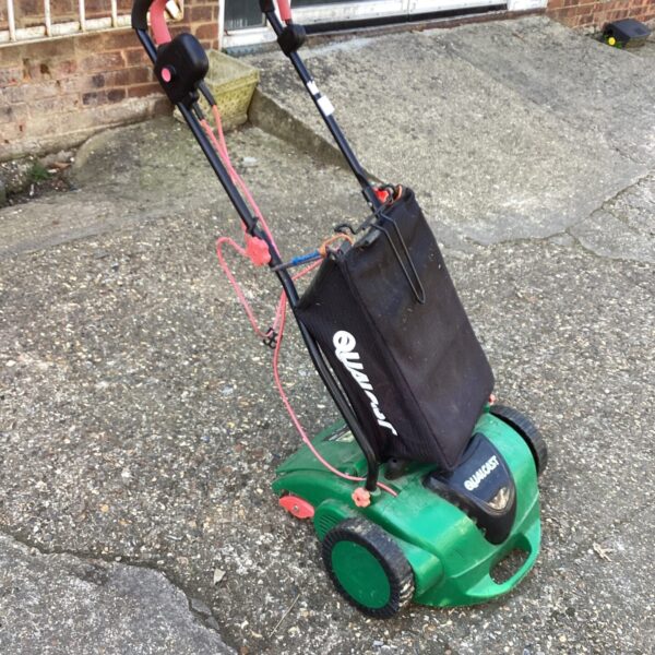 Qualcast electric lawn rake with collection bag, garden tool.