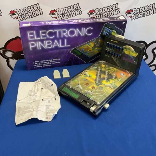 Vintage electronic pinball game with manual, collectible tabletop arcade.