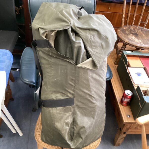 Folded vintage six man tent ready for camping or collection.