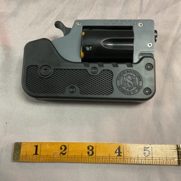 Close-up of a vintage plastic switch gun by Standard Manufacturing.