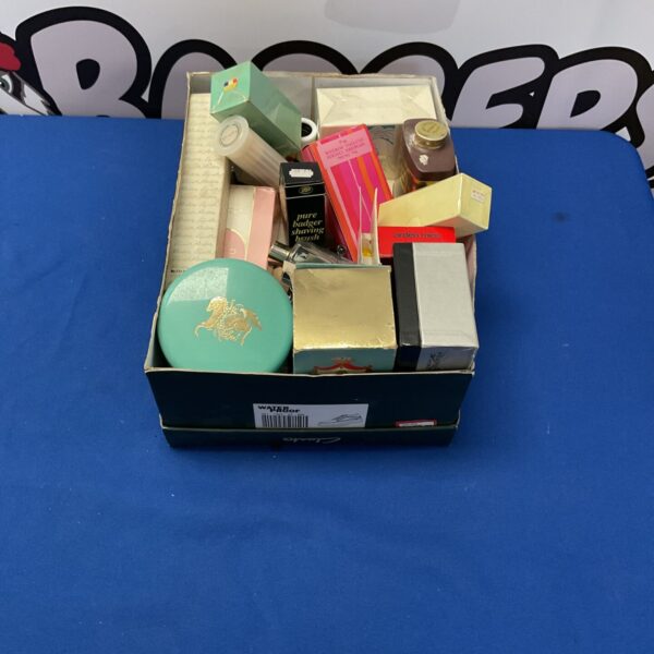 Assorted beauty products and perfumes in a mixed lot.