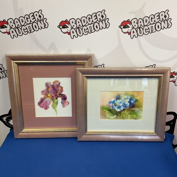 Framed floral prints pair, vibrant irises and blossoms.