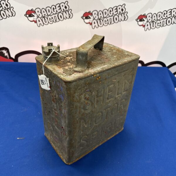 Front view of a vintage Shell fuel can with embossed branding.