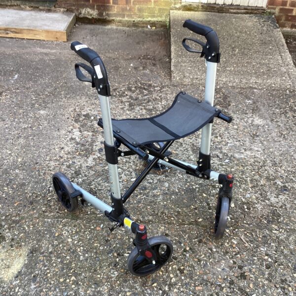 Front view of a wheeled walking aid trolley with a seat.