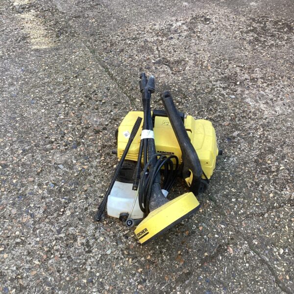 Used Karcher pressure washer with patio cleaner attachment for outdoor cleaning.