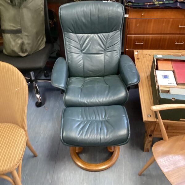 Vintage leather recliner chair with footrest in good condition.