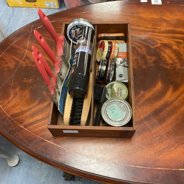 Shoe cleaning kit with brushes, polishes, and waterproof spray.