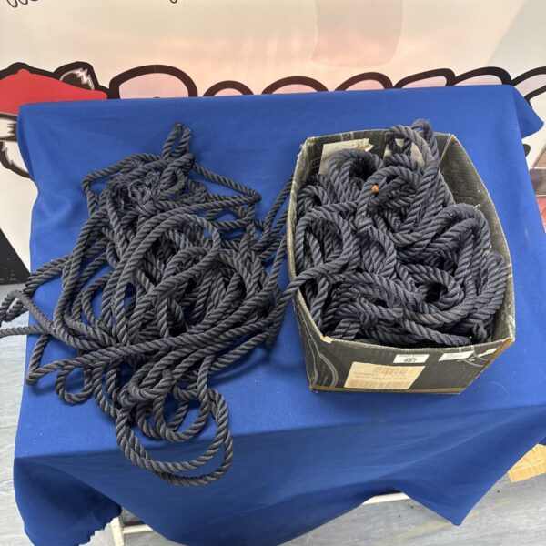 Coil of dark blue braided boating rope for marine use.