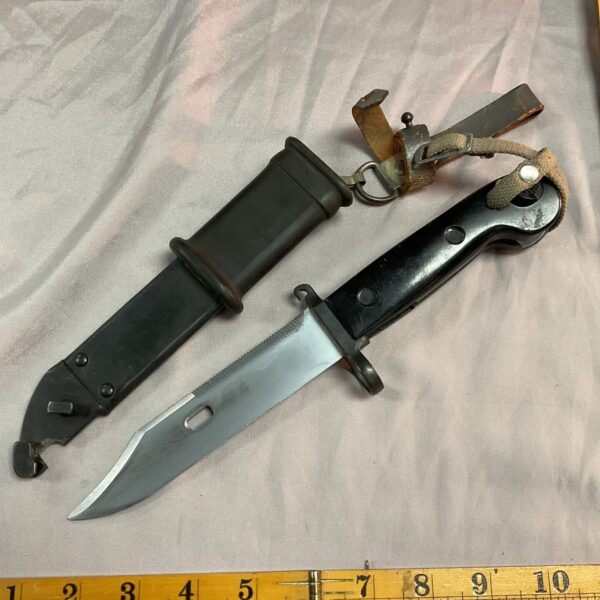 East German AK47 bayonet with sawback blade and black scabbard.