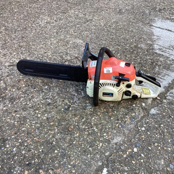 Greenstar petrol chainsaw in used condition, vintage garden tool.