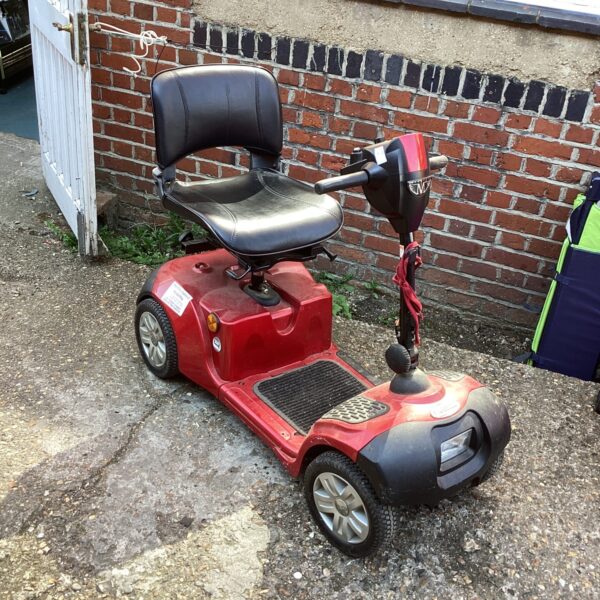Side view of a used Neo mobility scooter for sale.